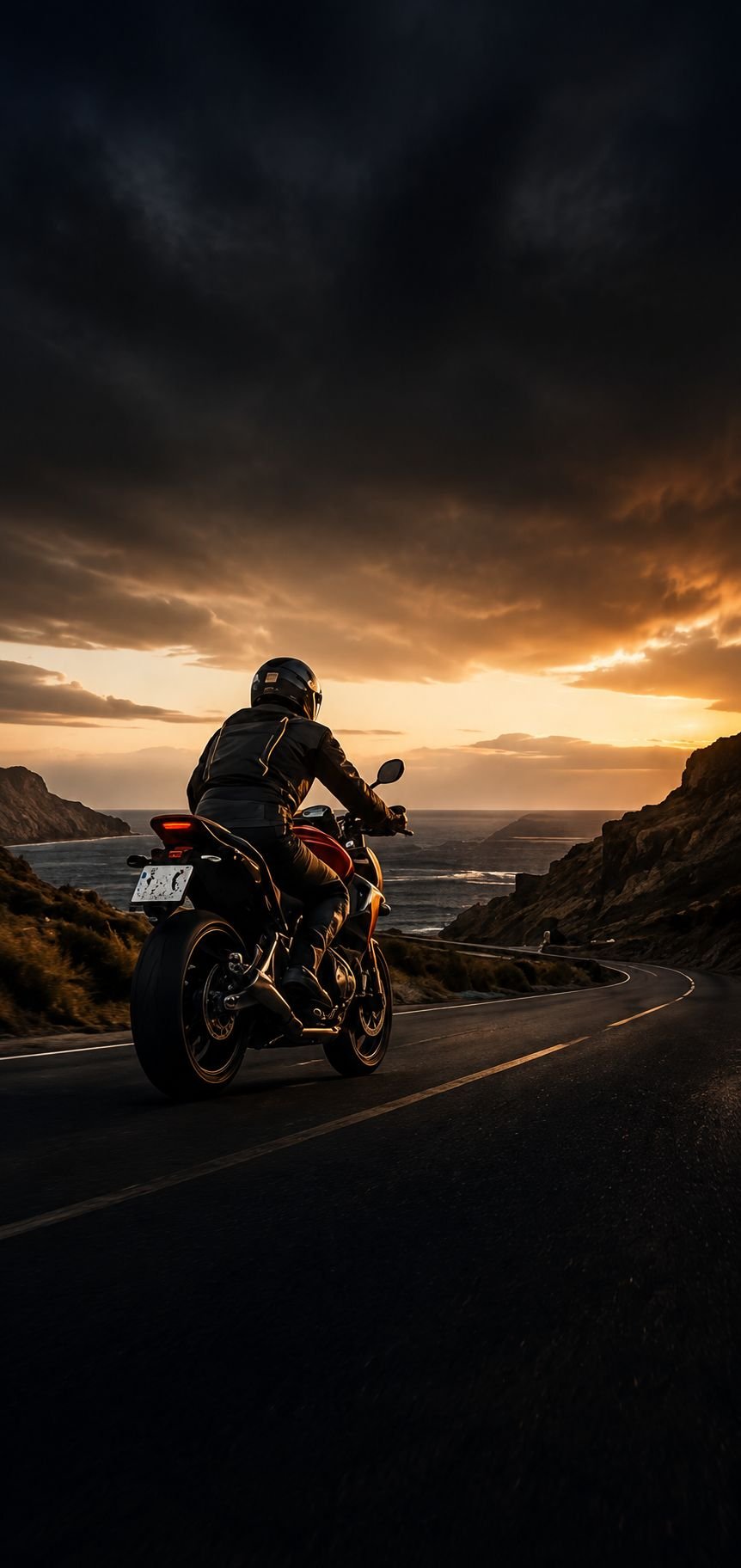Rider on the GC-200 coastal road at sunrise